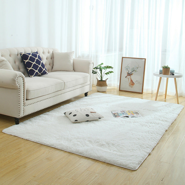 Fluffy Rug showcasing a stylish pink color, ideal for cozy bedroom decor.