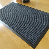 Anti-slip Mat Polypropylene Carpet Disinfection Mat in a stylish entryway with modern decor.