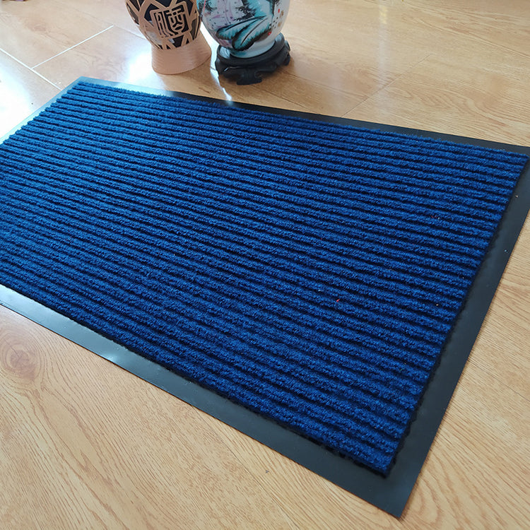 Stylish Anti-slip Mat made from Polypropylene fiber, shown in a chic entryway with a contemporary design.