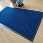 Stylish Anti-slip Mat made from Polypropylene fiber, shown in a chic entryway with a contemporary design.
