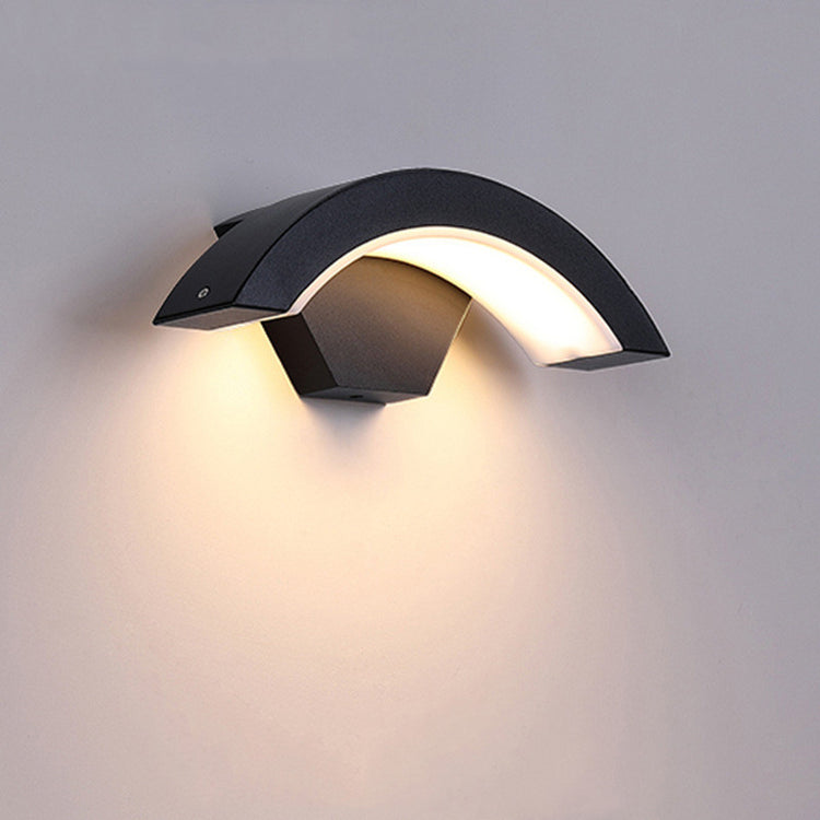 Curved Moon Induction Wall Light showcasing its sleek design and warm glow, perfect for illuminating indoor and outdoor spaces.