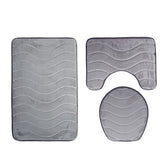 Three-piece Toilet Seat Toilet Mat Bathroom Non-slip Mat with a close-up view of the non-slip backing, ensuring secure placement on the floor.