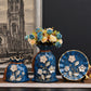 Stylish Three-piece European-style Ceramic Vase set with modern decor and fresh flowers, adding elegance to any room.