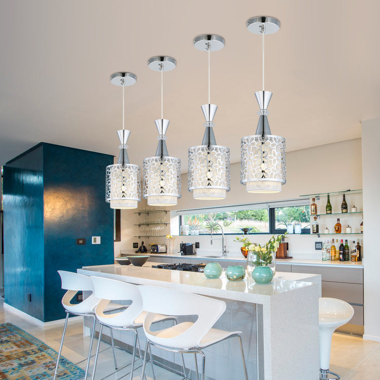 The Modern Minimalist Nordic Single Head Chandelier showcasing its wrought iron material in a vibrant dining space.