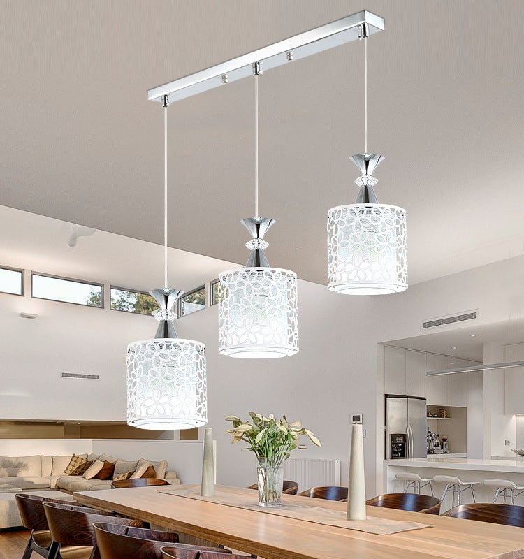 Modern Minimalist Nordic Single Head Chandelier illuminating a stylish dining room with soft lighting.