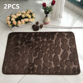 Absorbent Non-slip Stone Embossed Carpet Floor Mat in a bathroom, demonstrating its absorbent qualities and elegant stone design.