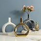 Chic Nordic Style Heart Hollow Out Electroplated Ceramic Vase showcased with fresh flowers, ideal for home decoration.