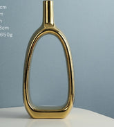 Different styles of the Nordic Style Heart Hollow Out Electroplated Ceramic Vase Decoration displayed together, highlighting versatility.