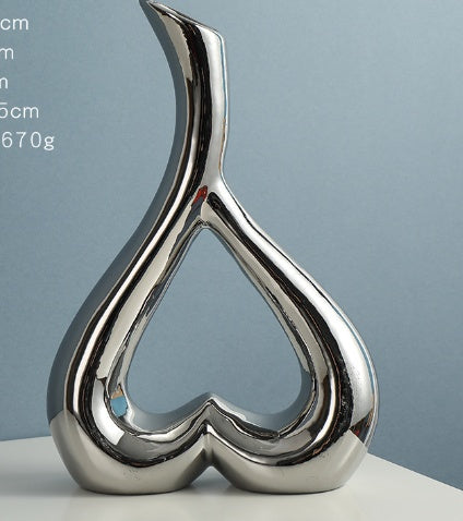Nordic Style Heart Hollow Out Electroplated Ceramic Vase Decoration featuring an elegant design, ideal for home decor.