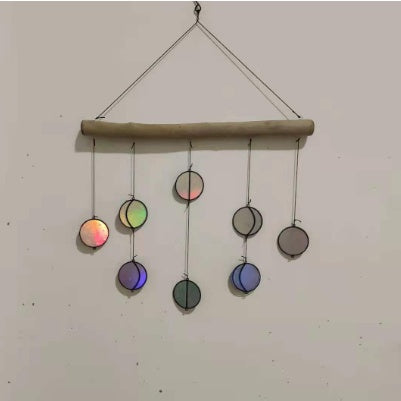 Elegant Rainbow Hanging Art Wall Decoration displayed outdoors, creating a serene atmosphere with gentle wind chime sounds.
