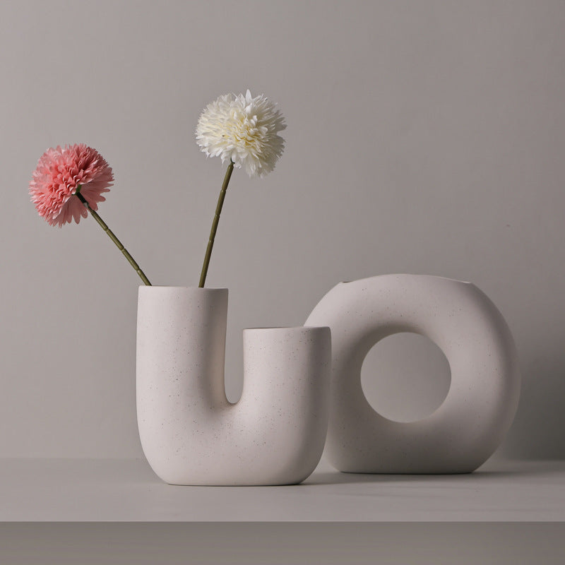 Stylish Modern Minimalist Ceramic Vase Art Decorative Ornaments displayed with flowers, enhancing home decor.