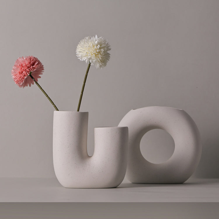 Stylish Modern Minimalist Ceramic Vase Art Decorative Ornaments displayed with flowers, enhancing home decor.