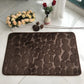Absorbent Non-slip Stone Embossed Carpet Floor Mat lying flat in a kitchen, emphasizing its non-slip feature and vibrant colors.