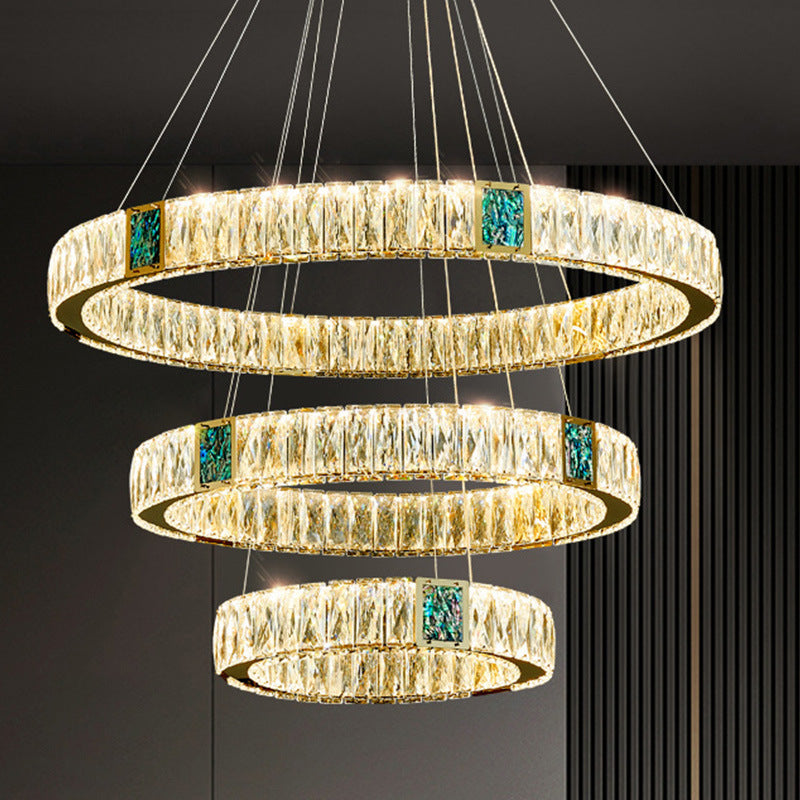 Light Luxury Crystal Chandelier enhancing the elegance of a living dining room with its stunning design.