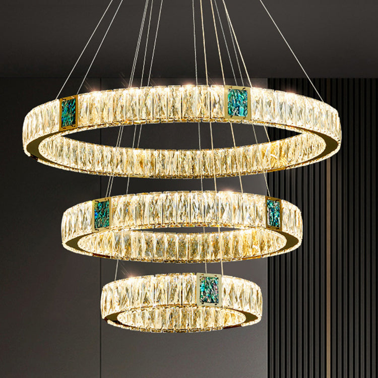 Light Luxury Crystal Chandelier enhancing the elegance of a living dining room with its stunning design.