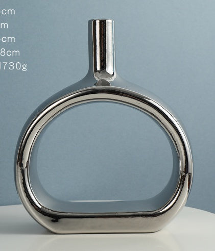 Stylish Nordic Style Heart Hollow Out Electroplated Ceramic Vase with heart design, ideal for home decor.